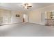 Spacious bonus room features a built-in bookcase, ceiling fan and staircase access at 1101 Temple St, Raleigh, NC 27609