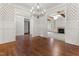 Inviting dining room with hardwood floors, wainscoting, and seamless flow to adjoining living spaces at 1101 Temple St, Raleigh, NC 27609