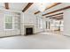 Bright living room with fireplace, built-ins, and views into the kitchen with eat-in space at 1101 Temple St, Raleigh, NC 27609