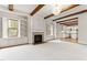 Open-concept living room with fireplace, built-ins, and views into the kitchen. Perfect for gatherings at 1101 Temple St, Raleigh, NC 27609