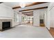 Open-concept living room with fireplace, built-ins, and views into the kitchen. Perfect for entertaining at 1101 Temple St, Raleigh, NC 27609