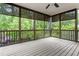 Enjoy the view in this comfortable screened-in porch with a ceiling fan, great for relaxing outdoors at 1101 Temple St, Raleigh, NC 27609