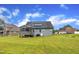 Spacious backyard with lush green lawn, providing ample space for recreation and relaxation at 1109 Agio Ct, Zebulon, NC 27597