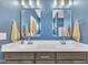 Bright bathroom featuring a double vanity, modern lighting, and decorative mirrors at 1109 Agio Ct, Zebulon, NC 27597