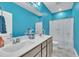 Bathroom featuring double vanity, granite counters, and blue painted walls at 1109 Agio Ct, Zebulon, NC 27597