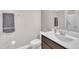 This bathroom features a white vanity, a mirror, and a shower with glass door at 1109 Agio Ct, Zebulon, NC 27597