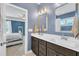 Stylish bathroom featuring a double vanity, decorative mirrors, and ensuite bedroom access at 1109 Agio Ct, Zebulon, NC 27597