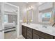 Bathroom featuring double sinks and a neutral color palette, connecting to bedroom at 1109 Agio Ct, Zebulon, NC 27597
