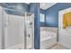 The bathroom boasts a tub, shower, and stylish fixtures at 1109 Agio Ct, Zebulon, NC 27597