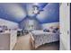 This charming bedroom offers whimsical decor with a star-painted ceiling and natural light at 1109 Agio Ct, Zebulon, NC 27597