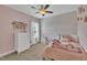 The pink bedroom features a plush unicorn, soft lighting, and a serene, peaceful atmosphere at 1109 Agio Ct, Zebulon, NC 27597
