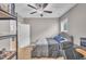 This bedroom features carpet floors, a ceiling fan, and a gray headboard at 1109 Agio Ct, Zebulon, NC 27597