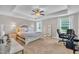 Spacious main bedroom with tray ceilings, carpeted floors, plenty of natural light and neutral colors at 1109 Agio Ct, Zebulon, NC 27597