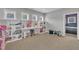 Versatile bonus room with plenty of shelving, natural light, and neutral tones at 1109 Agio Ct, Zebulon, NC 27597