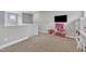 Spacious bonus room, perfect for playroom, with carpet flooring at 1109 Agio Ct, Zebulon, NC 27597