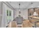 Bright dining room with large glass sliding doors that lead to an outdoor deck area at 1109 Agio Ct, Zebulon, NC 27597