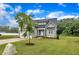A beautiful two-story gray home with well-maintained landscaping and a lush green lawn at 1109 Agio Ct, Zebulon, NC 27597