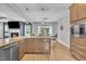 Modern kitchen featuring granite countertops, stainless appliances, hardwood flooring and open floor plan at 1109 Agio Ct, Zebulon, NC 27597