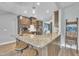 Spacious kitchen featuring an island with barstool seating, stainless steel appliances and modern design at 1109 Agio Ct, Zebulon, NC 27597