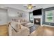 Living room with a fireplace and neutral color scheme perfect for entertaining Gathering and friends at 1109 Agio Ct, Zebulon, NC 27597