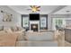 Cozy living room featuring a fireplace, hardwood flooring and open concept living at 1109 Agio Ct, Zebulon, NC 27597