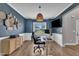 Stylish home office with a modern desk, ergonomic chair, and attractive wall decor at 1109 Agio Ct, Zebulon, NC 27597