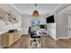 Bright home office with desk, ergonomic chair, and a stylish woven pendant light at 1109 Agio Ct, Zebulon, NC 27597
