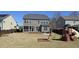 Spacious backyard featuring a playset and ample room for recreation and relaxation at 1116 Trotter Bluffs Dr, Holly Springs, NC 27540