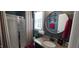 Well-lit bathroom featuring a walk-in shower, granite countertop, and stylish round mirror at 1116 Trotter Bluffs Dr, Holly Springs, NC 27540