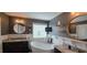 Stylish bathroom featuring a soaking tub, dual vanities, and elegant lighting fixtures at 1116 Trotter Bluffs Dr, Holly Springs, NC 27540