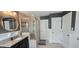 Bathroom featuring a glass shower, a granite vanity, and neutral tile flooring at 1116 Trotter Bluffs Dr, Holly Springs, NC 27540