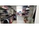 Walk-in closet with built-in shelving and racks, maximizing storage space for clothing and accessories at 1116 Trotter Bluffs Dr, Holly Springs, NC 27540