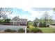 The community clubhouse and parking area enhanced with colorful landscaping, creating an inviting space for residents at 1116 Trotter Bluffs Dr, Holly Springs, NC 27540