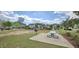 Community park with picnic tables, playground, and sports fields surrounded by well-maintained landscaping at 1116 Trotter Bluffs Dr, Holly Springs, NC 27540