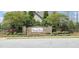 Stone entrance sign to Morgan Park neighborhood surrounded by lush landscaping and mature trees at 1116 Trotter Bluffs Dr, Holly Springs, NC 27540