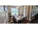 Inviting dining area featuring a large table, colorful rug, and natural light at 1116 Trotter Bluffs Dr, Holly Springs, NC 27540
