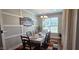 Light-filled dining room with modern chandelier and neutral walls, perfect for Gathering gatherings at 1116 Trotter Bluffs Dr, Holly Springs, NC 27540
