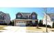 Charming two-story home features a stone accent garage and well-maintained lawn at 1116 Trotter Bluffs Dr, Holly Springs, NC 27540