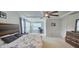 Bright main bedroom with tray ceiling, large windows, and a dedicated desk space at 1116 Trotter Bluffs Dr, Holly Springs, NC 27540