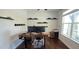 Office space boasts a wooden desk, dual monitors, and floating shelves with toy car decor at 1116 Trotter Bluffs Dr, Holly Springs, NC 27540