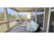 Relaxing screened porch with outdoor seating and views of the backyard and surrounding neighborhood at 1116 Trotter Bluffs Dr, Holly Springs, NC 27540