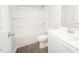 Well-lit bathroom featuring a shower-tub combo and modern white vanity at 112 Ambergate Ct, Rocky Mount, NC 27804