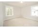 Neutral colored bedroom features two windows that provides great natural light at 112 Ambergate Ct, Rocky Mount, NC 27804