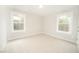 Well-lit bedroom with two windows offers a cozy and comfortable space at 112 Ambergate Ct, Rocky Mount, NC 27804