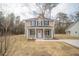 Inviting two-story home features a charming front porch and beautifully landscaped yard at 112 Ambergate Ct, Rocky Mount, NC 27804