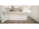 Modern kitchen features a breakfast bar, granite countertops, and stainless steel appliances at 112 Ambergate Ct, Rocky Mount, NC 27804