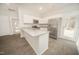 Modern kitchen with white cabinetry, granite countertops, and stainless steel appliances at 112 Ambergate Ct, Rocky Mount, NC 27804