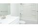 A well-lit bathroom featuring white fixtures, including a tub/shower combo and a single sink vanity at 117 Ambergate Ct, Rocky Mount, NC 27804