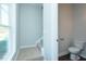 Powder room with hardwood flooring, a toilet, and stairs at 117 Ambergate Ct, Rocky Mount, NC 27804