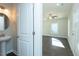 Bathroom with pedestal sink, hardwood flooring and view to living room at 117 Ambergate Ct, Rocky Mount, NC 27804